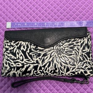 Patricia Nash black and white tooled leather wallet.